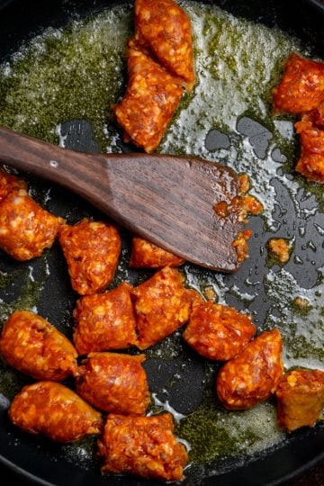 begin to break up sausage as it cooks