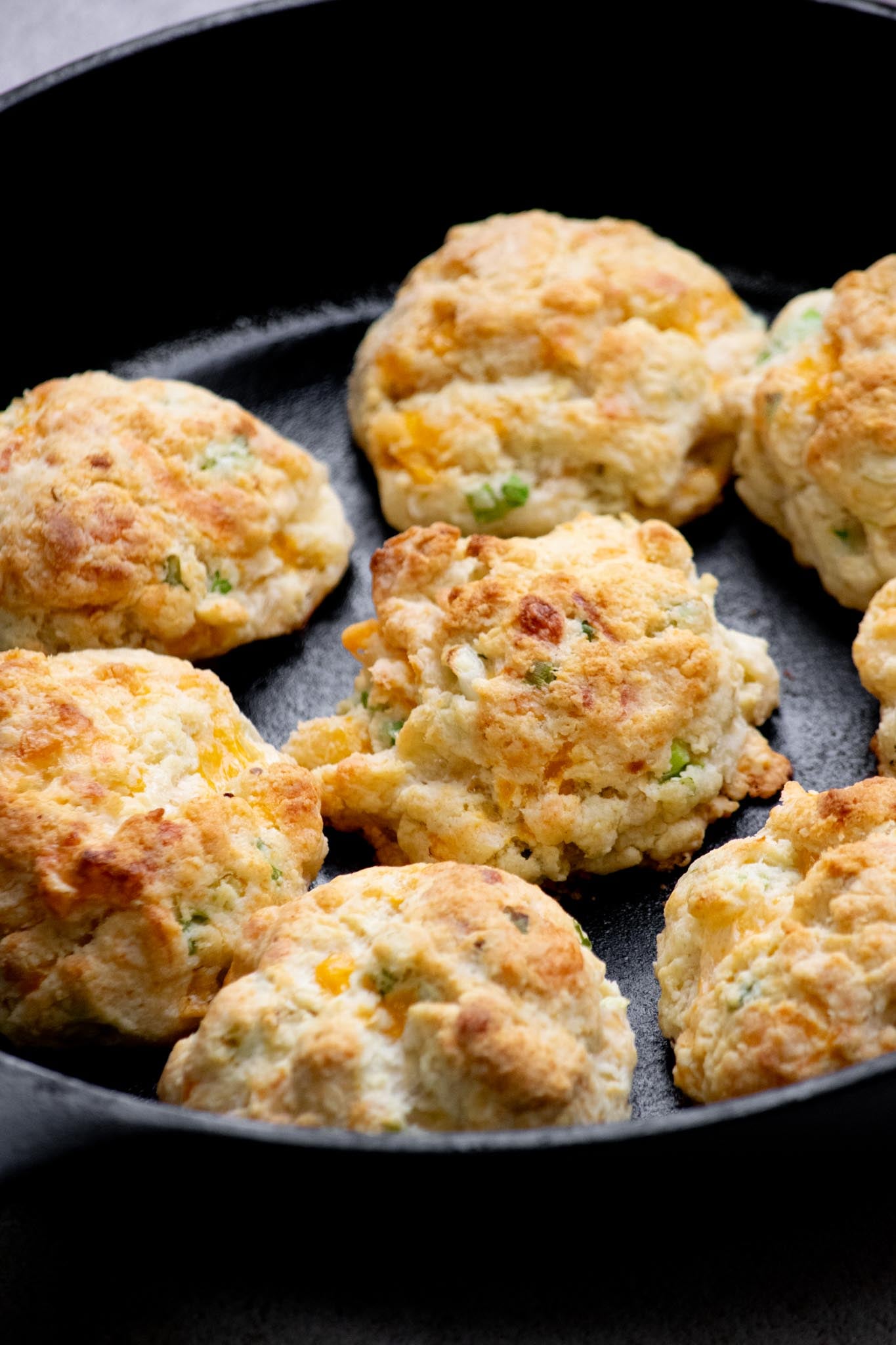 cheddar cheese biscuits in cast iron skillet. 