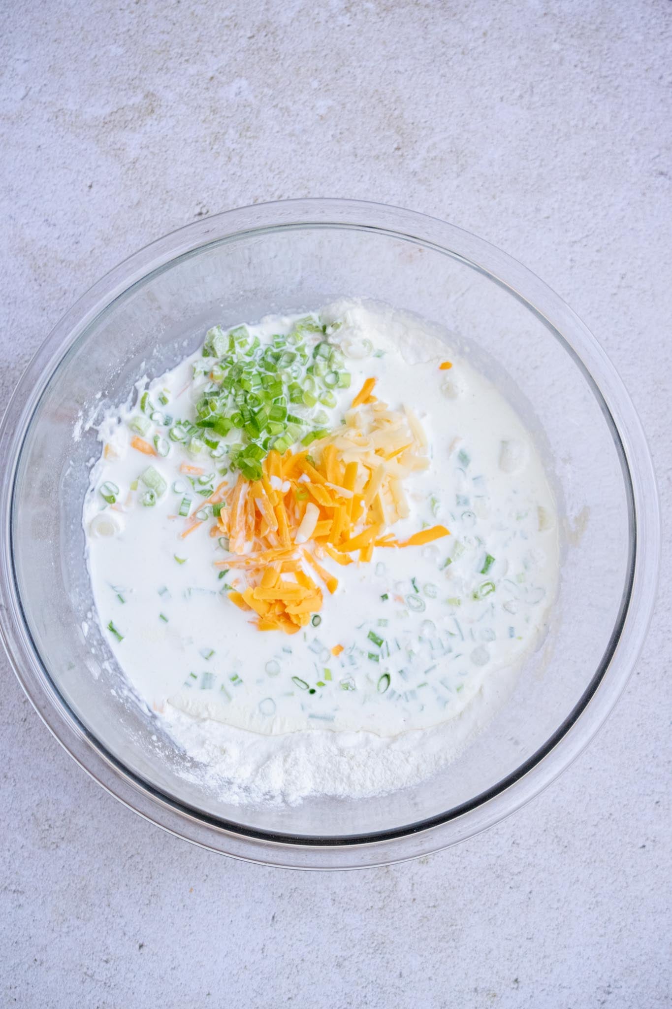 Add cheese, scallions and cream.