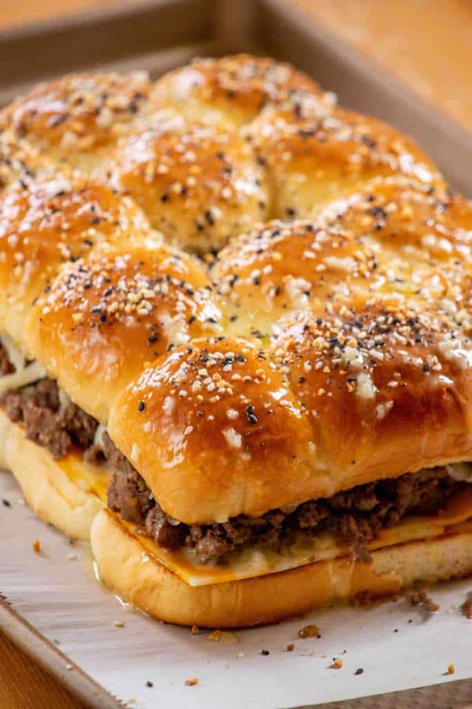 Once you've got your buns all layered up, sprinkle the top with everything bagel seasoning, and bake in preheated oven on a parchment paper lined baking sheet, until just toasty and cheese is melted.&nbsp;