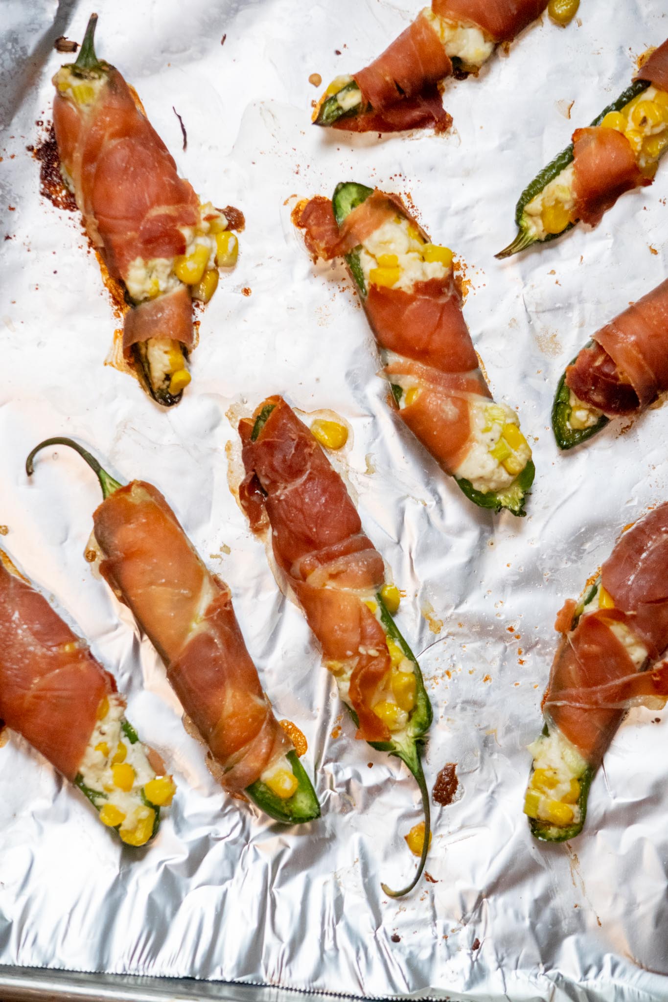 Bake for 15 minutes, until prosciutto is crisp, cheese is bubbly, and jalapeños are softened.
