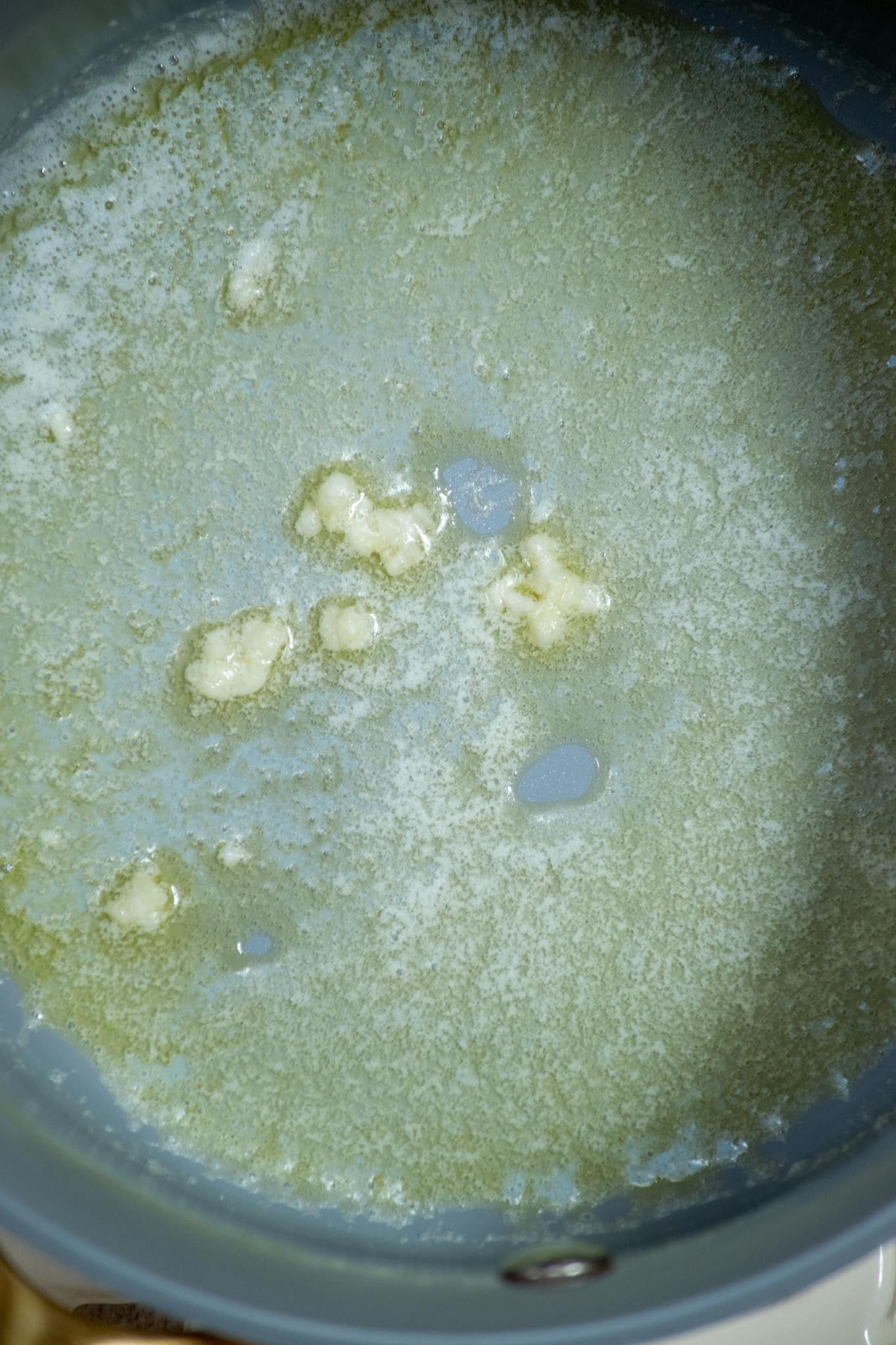 Sauté the garlic. Melt the butter in a medium saucepan over medium heat. Add the garlic and cook for about 1 minute, just until fragrant.