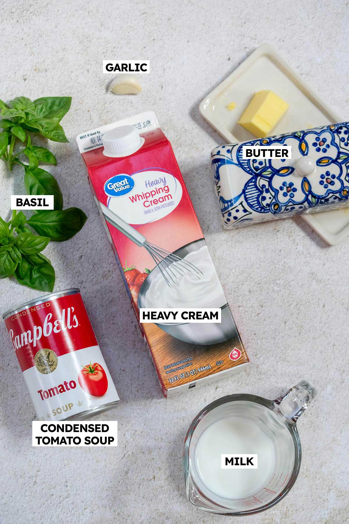 How to Make Canned Tomato Soup Better- use heavy cream, milk, basil, garlic and butter.