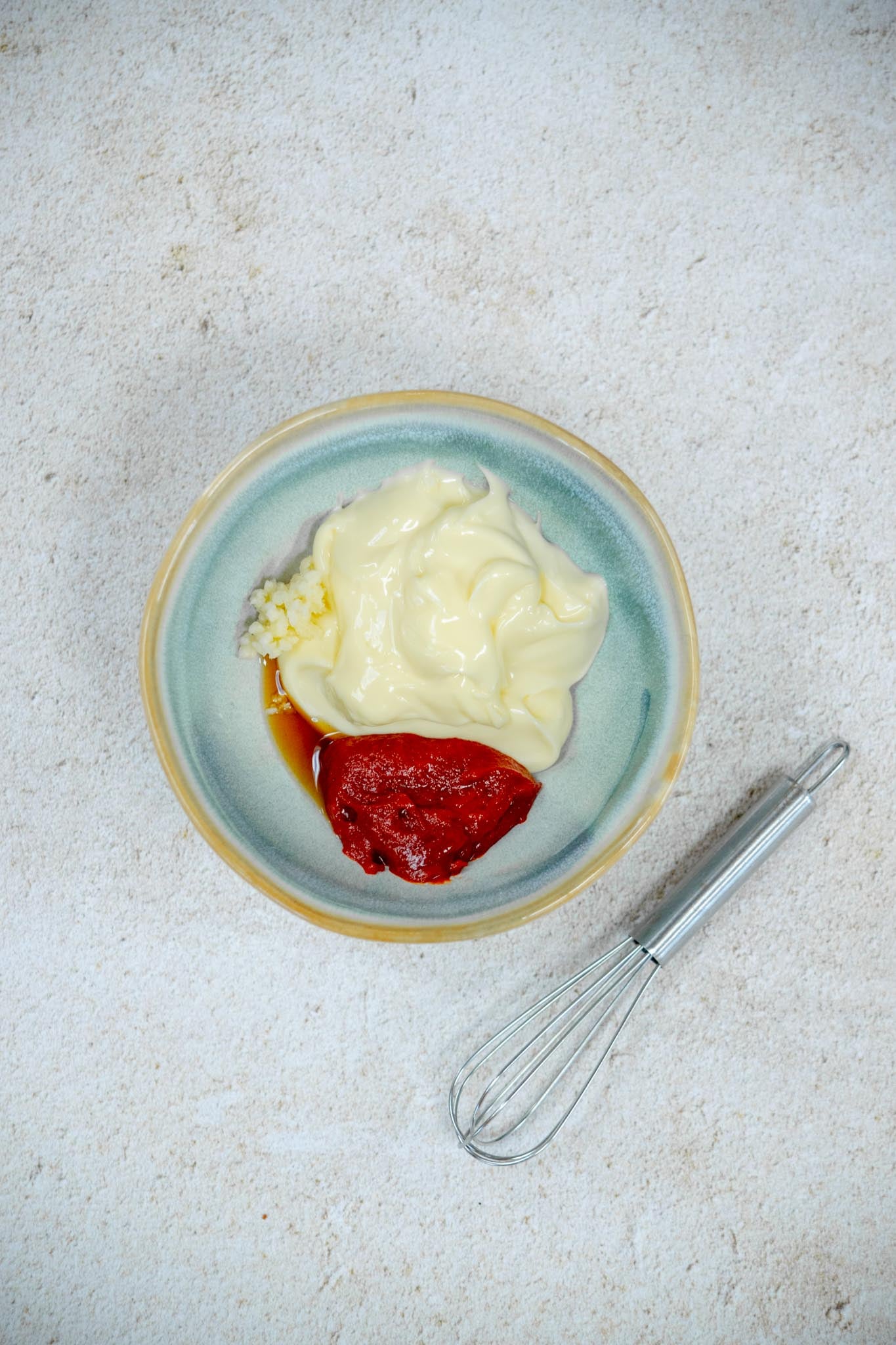 add the mayo, Gochujang, garlic and sesame oil to a bowl