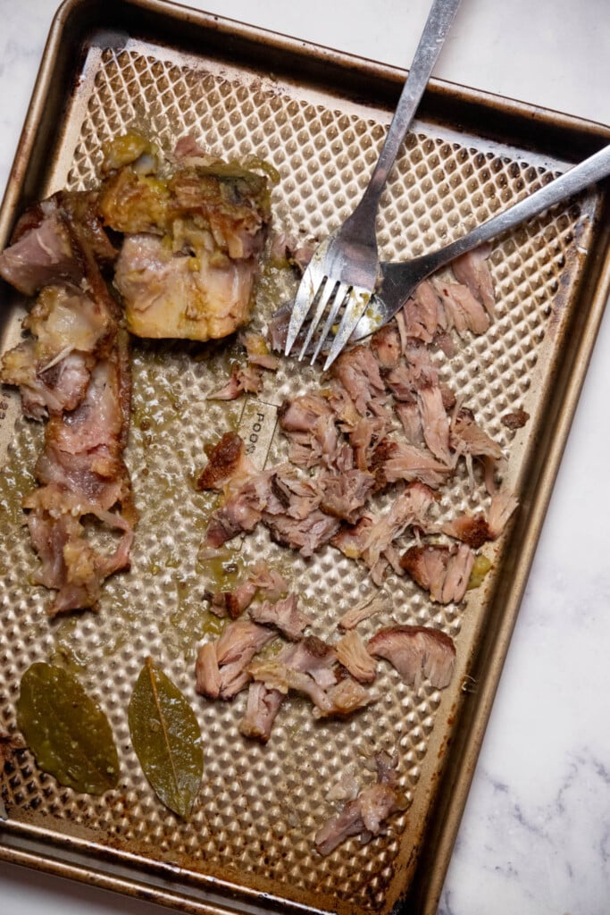 remove bay leaves and discard. shred ham meat and add back to soup, discarding any excess fat or bones. 