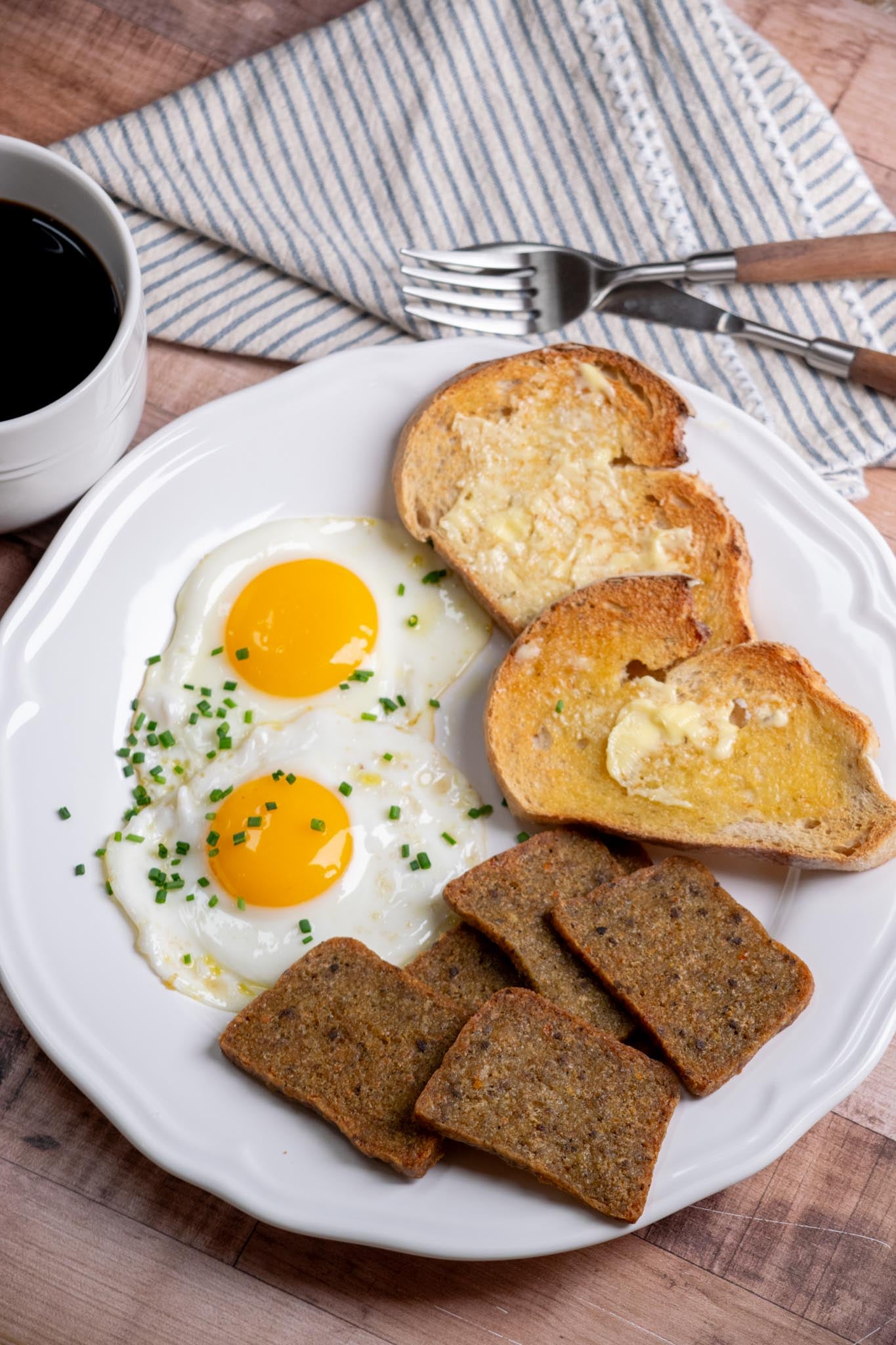 Air fryer scrapple with fried egg and toast.