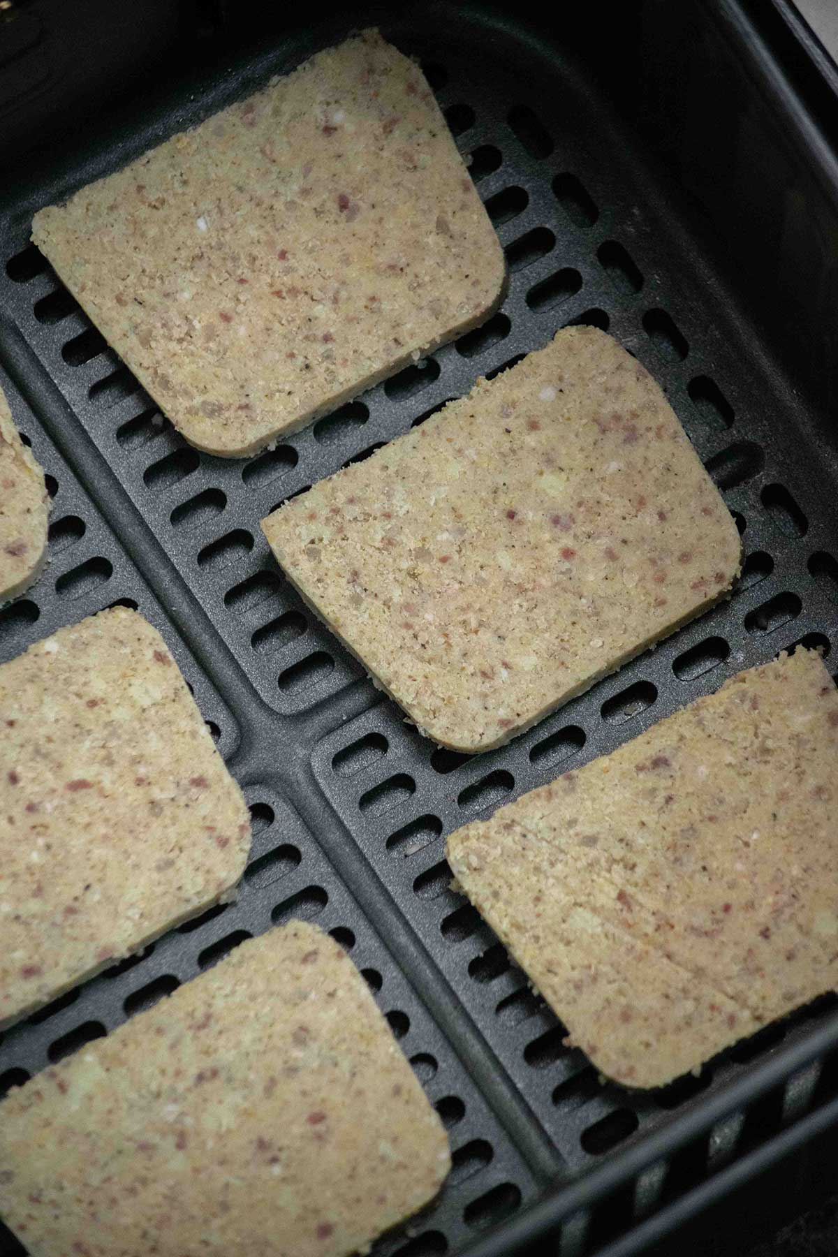 Arrange in an even layer in the air fryer, making sure the pieces do not overlap so they don't stick. Air fry at 400° for 10 minutes, undisturbed. Resit the urge to fiddle with the slices so they can build a nice crust, and prevent breakage.