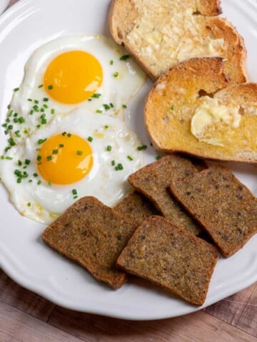 How to Cook Scrapple in the Air Fryer for breakfast- plated with eggs and toast.
