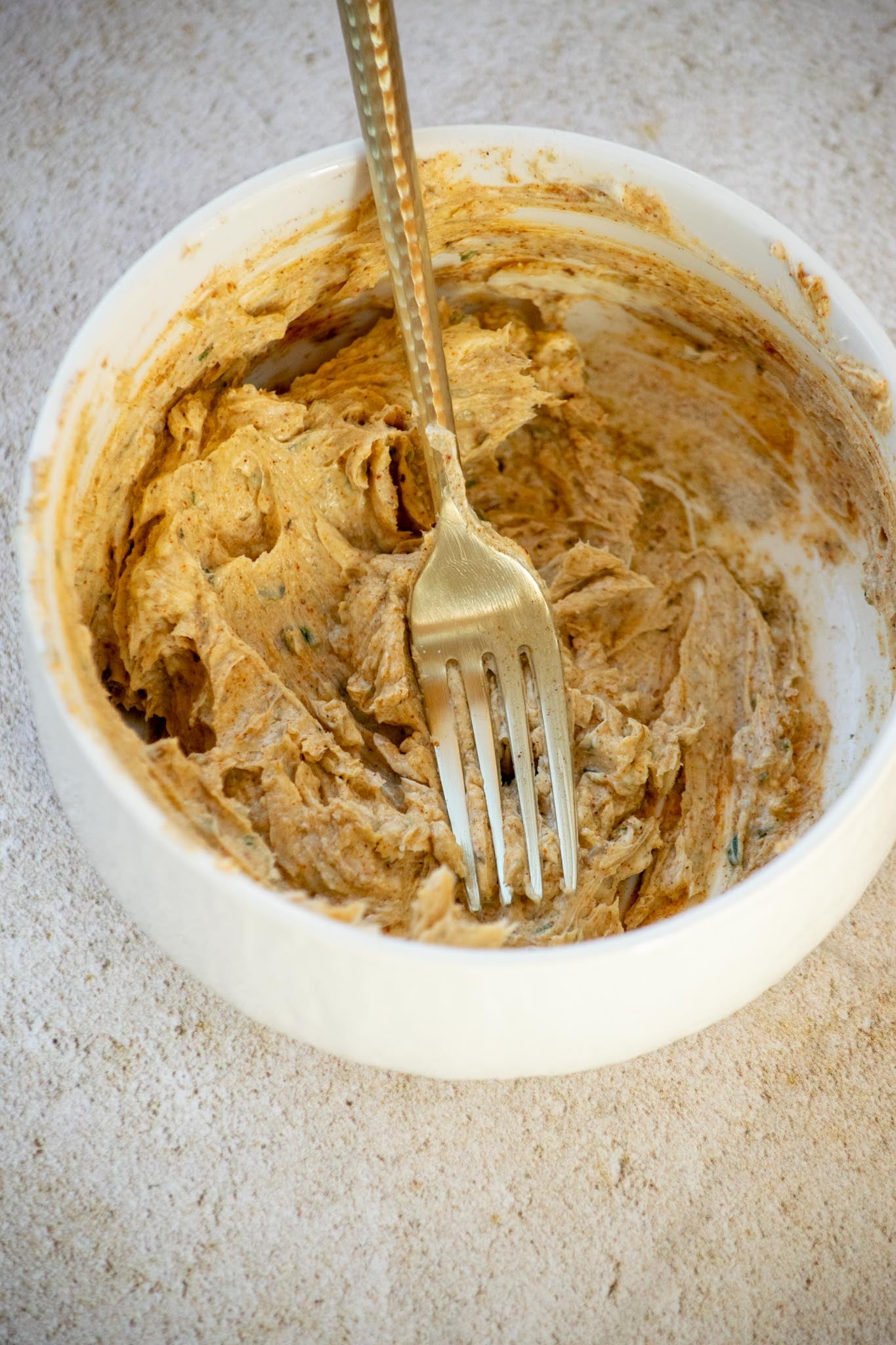 Make the herb butter. Mix the softened butter with garlic powder, onion powder, sage, thyme, rosemary, salt, pepper, and smoked paprika.