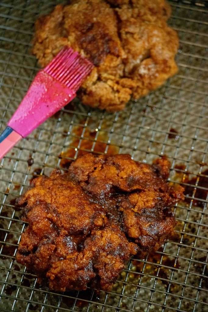 brushing the chicken with the spice oil