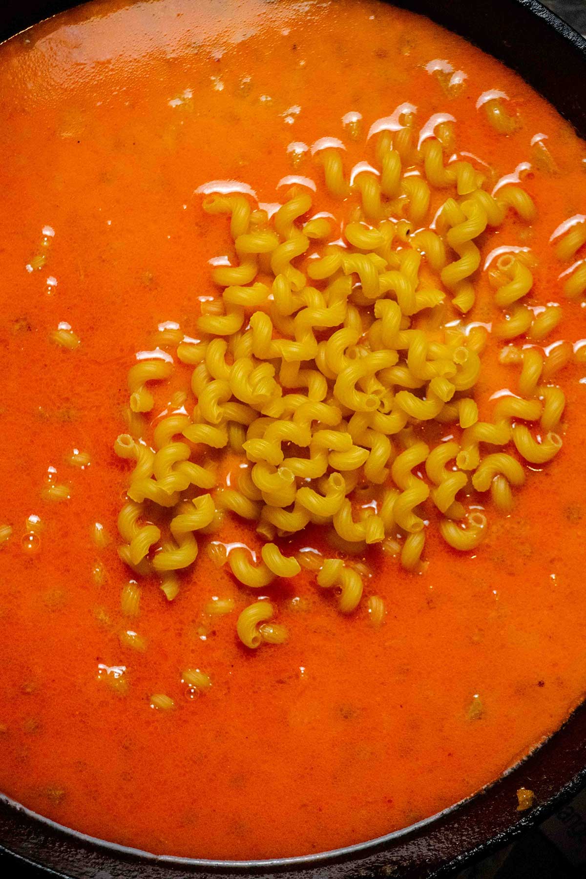 Cook the pasta. Stir in the beef broth, milk, and pasta. Bring to a simmer and cook, stirring occasionally, until the pasta is al dente and the sauce has thickened.