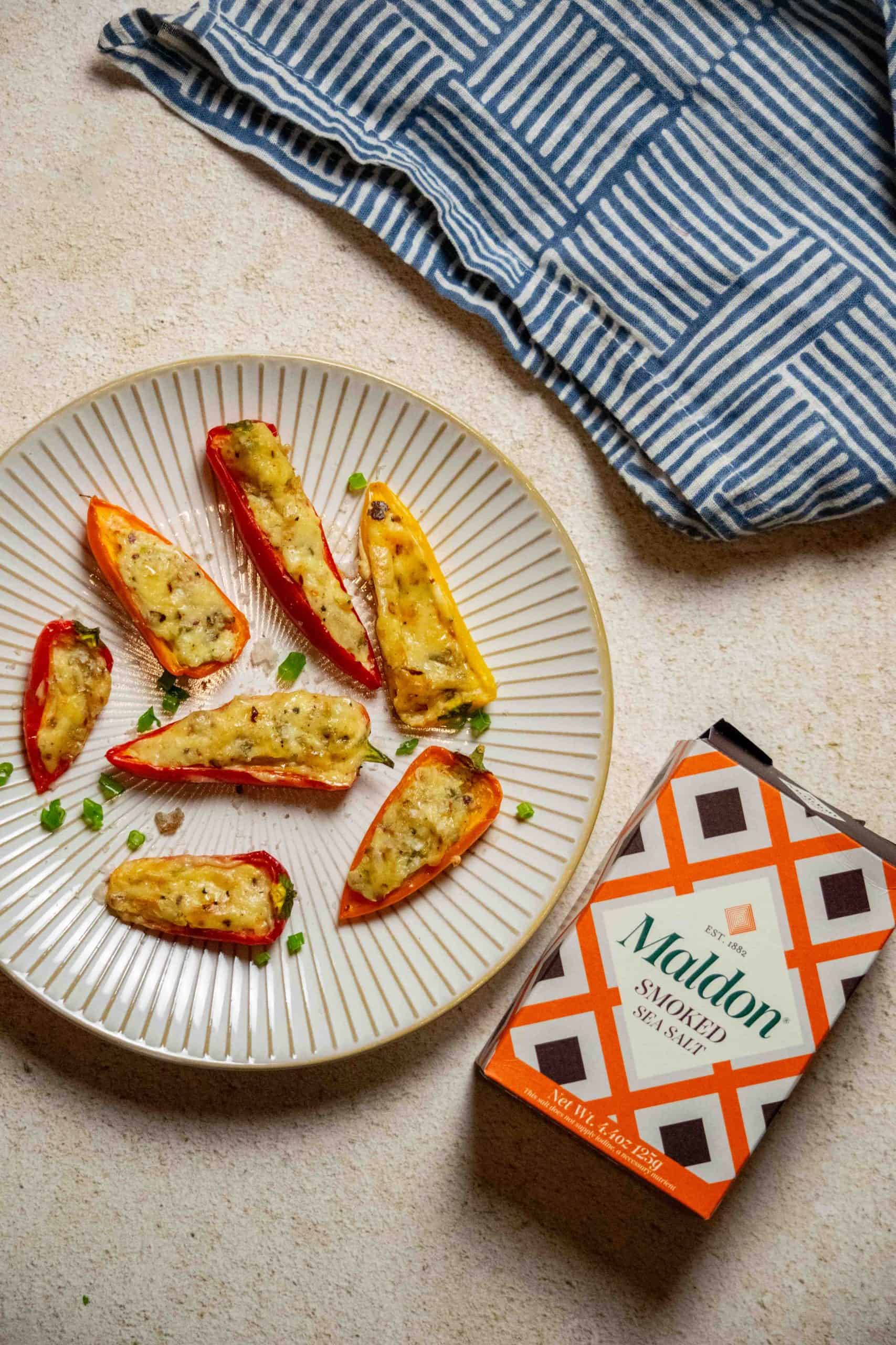 topping the mini pepper appetizers with smoked sea salt