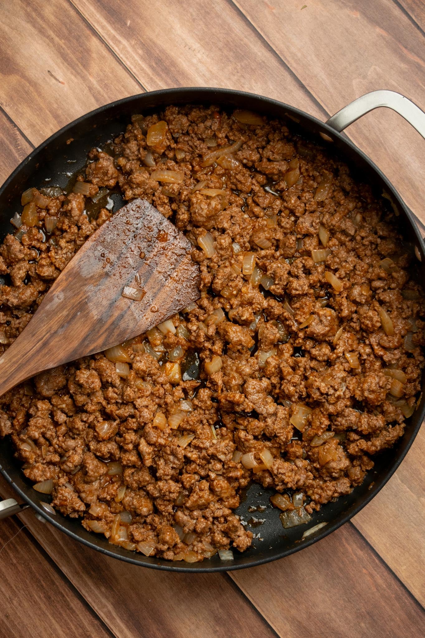 Add the tomato paste and garlic. Stir both into the beef mixture and cook for 2–3 minutes, until the tomato paste deepens slightly in color.