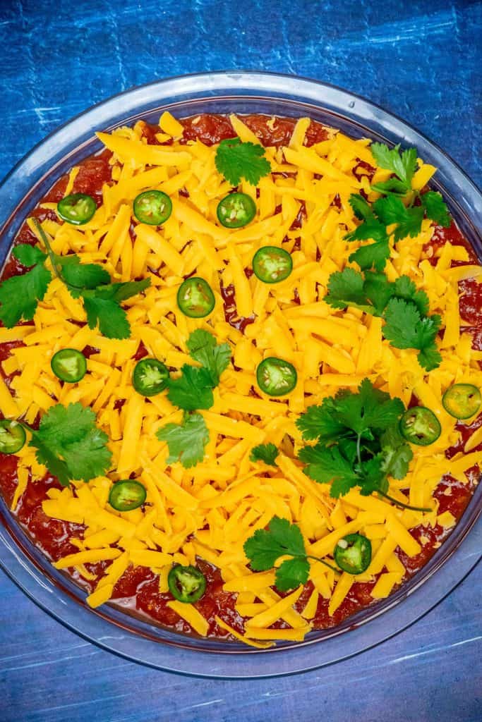 top with grated cheddar, cilantro leaves, and sliced jalapeños
