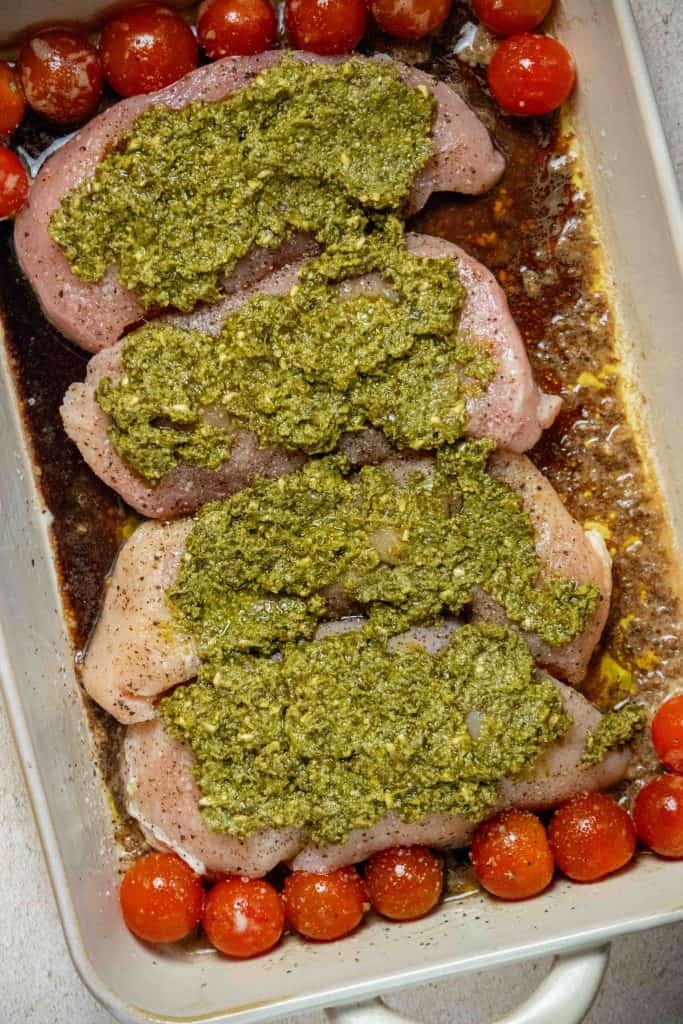 top each piece of chicken with pesto