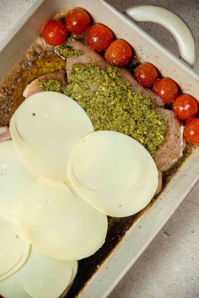 then top each piece of chicken with provolone