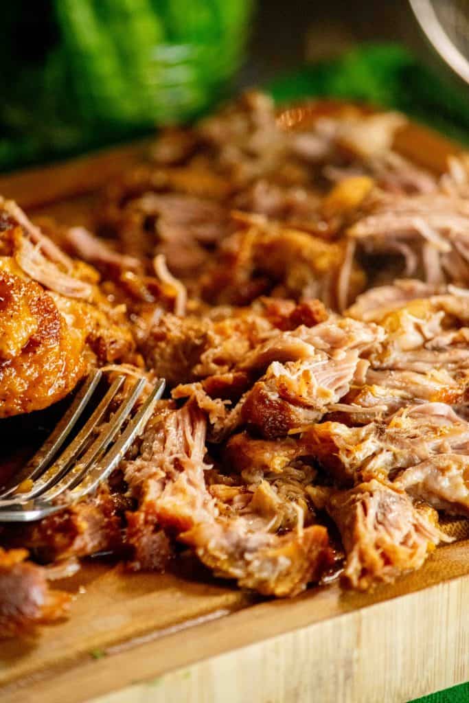 discard bay leaves, and shred pork