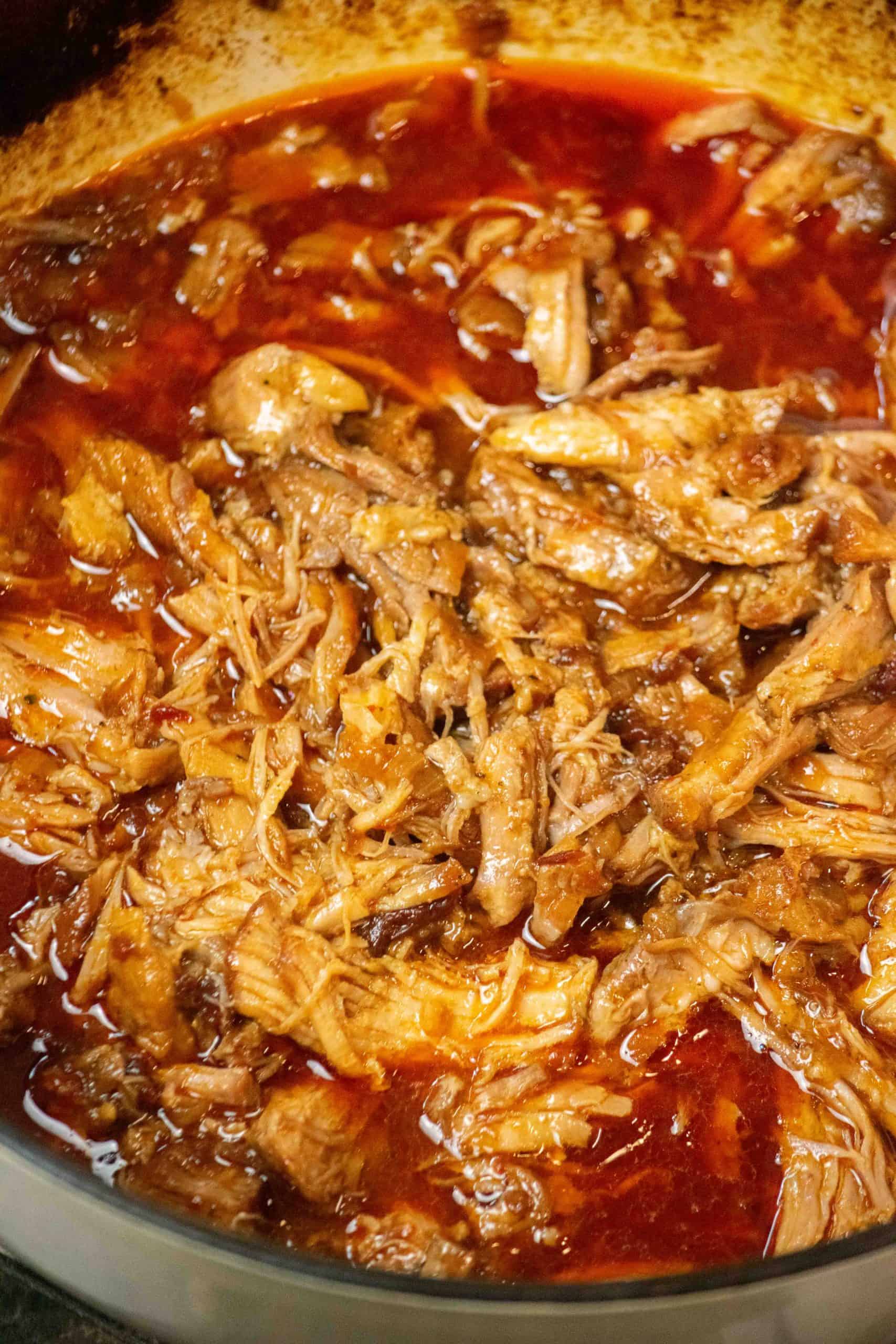 shredded Easy Dutch Oven Pulled Honey Chipotle Pork Recipe in pot