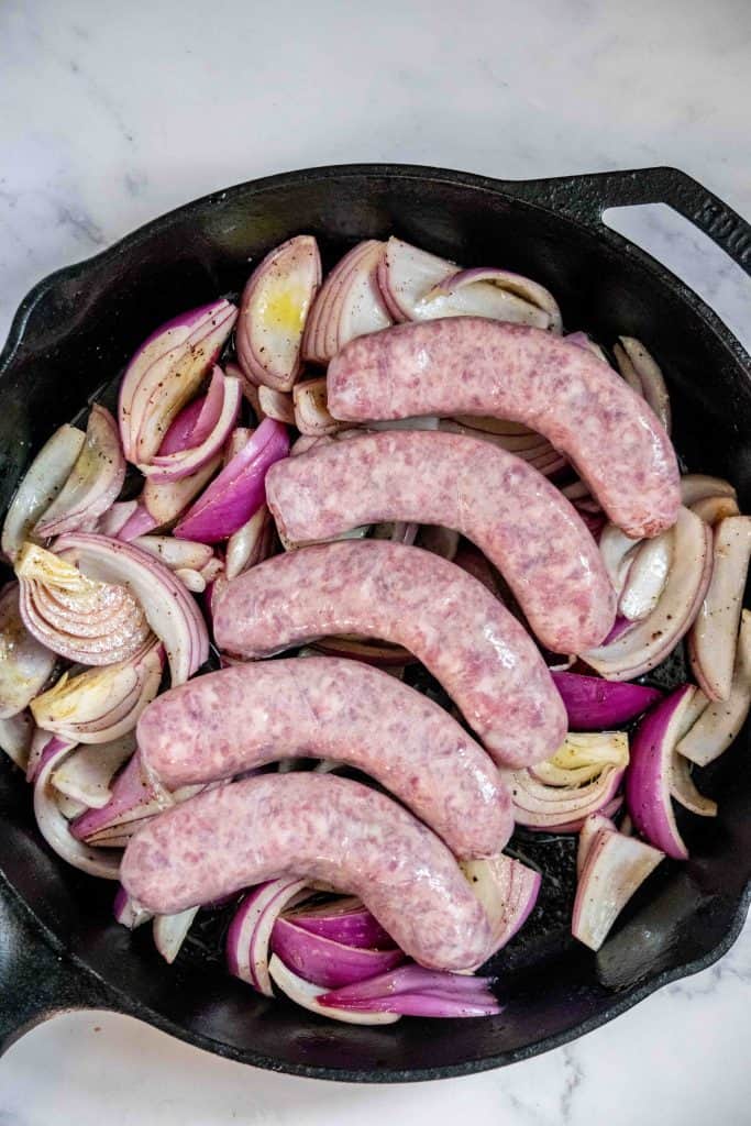 arrange sausage over onions and transfer to the oven