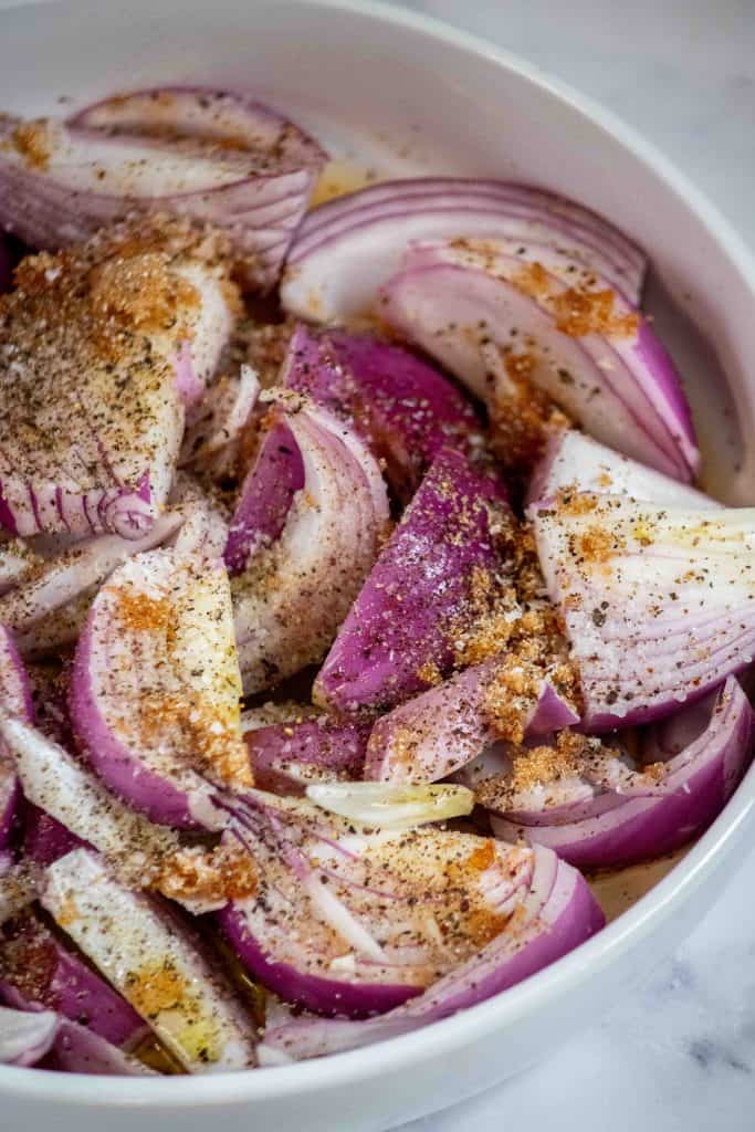 slice the onions and toss with brown sugar, vinegar, salt, pepper, and olive oil.