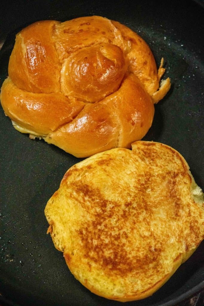 Generously butter the rolls, and toast in a skillet until golden brown