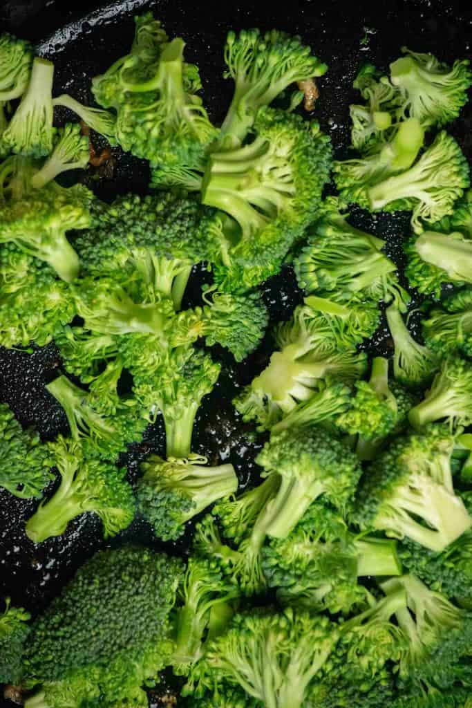 remove cooked chicken and add broccoli to the pan