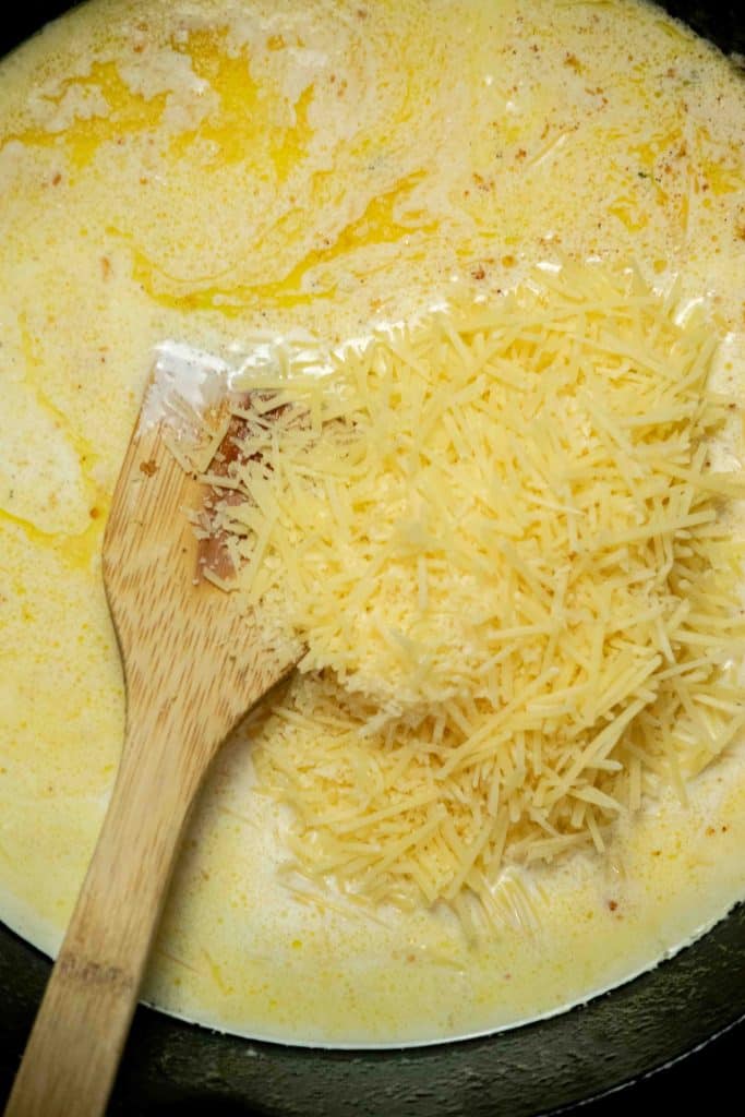 melt butter, add garlic and cook until fragrant, then add heavy cream and parmesan and stir well