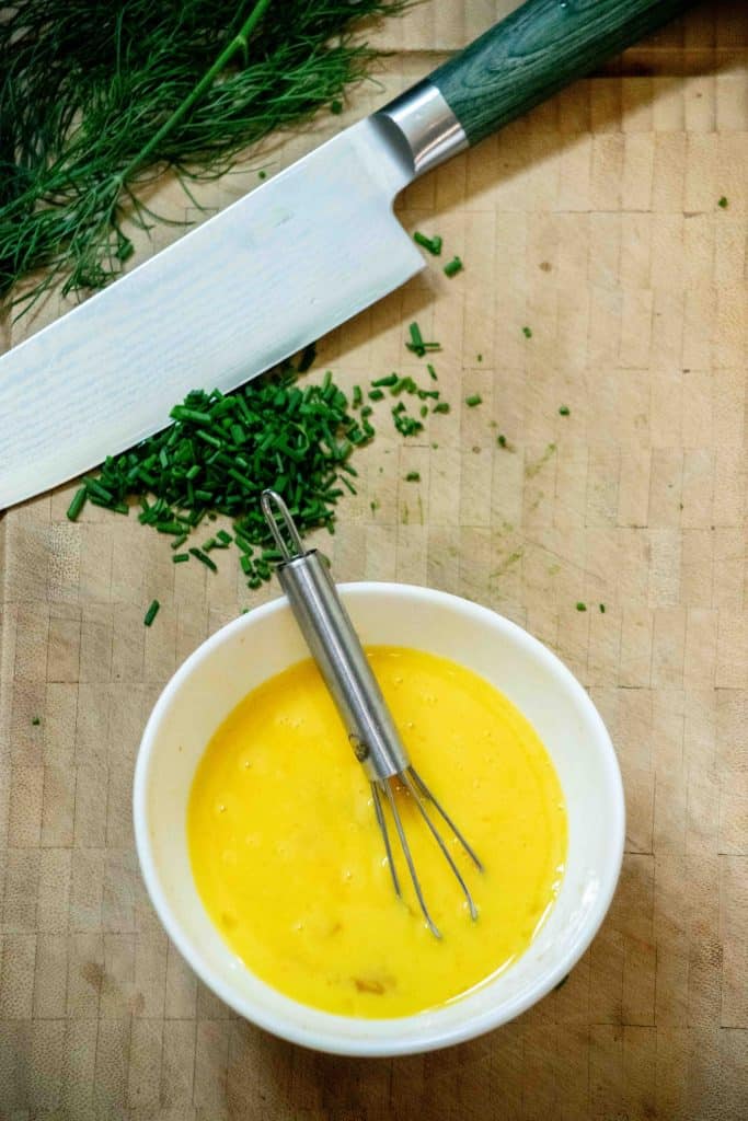 prep herbs, and whisk hot sauce into eggs