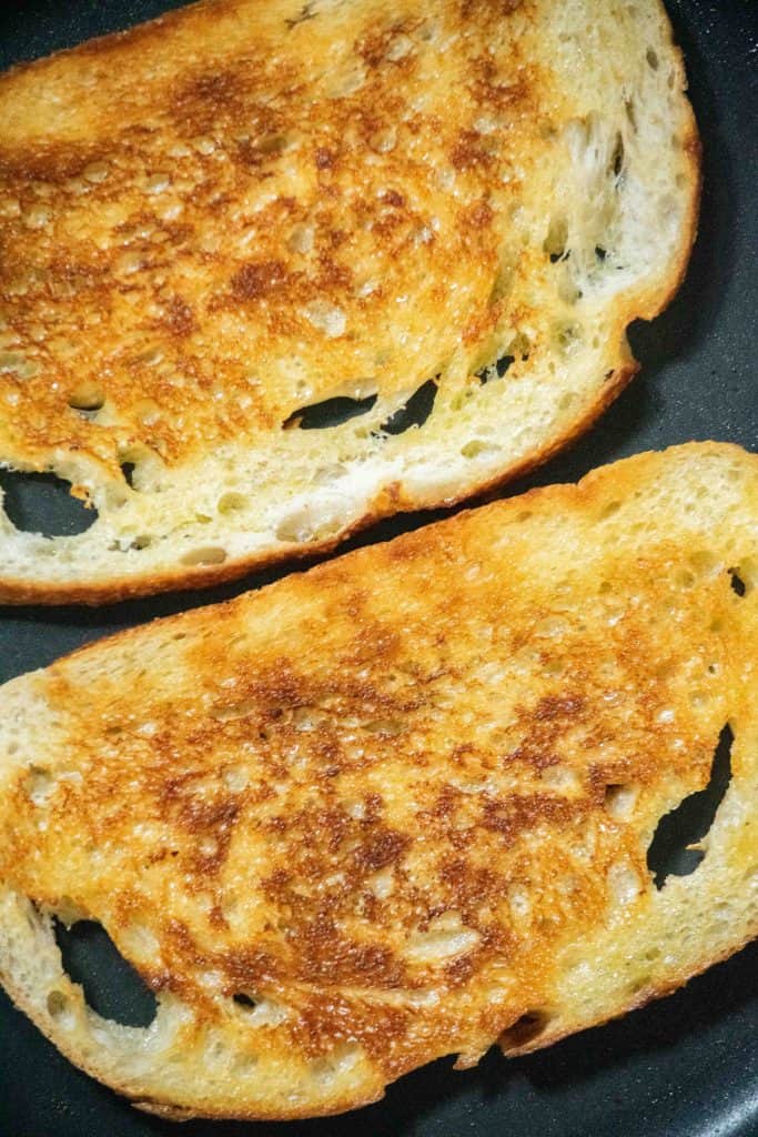 toast bread in a nonstick pan until golden on both sides