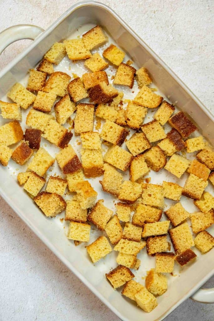 grease a baking dish and layer cornbread in bottom