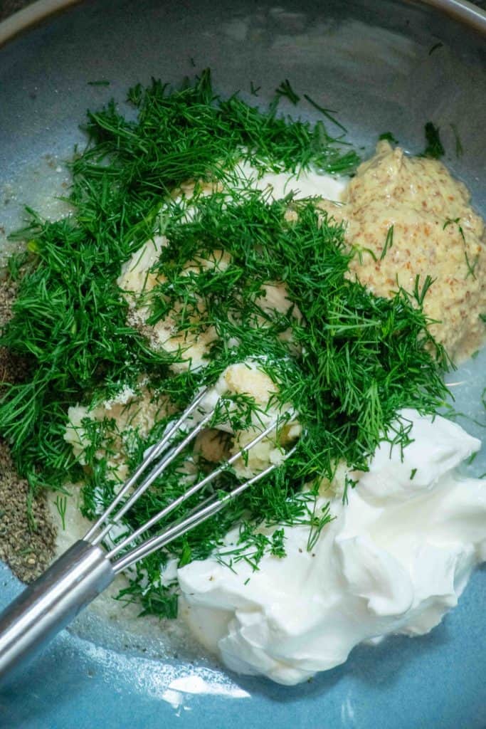 add sour cream, garlic, dill, spices, mayo and vinegar to a bowl