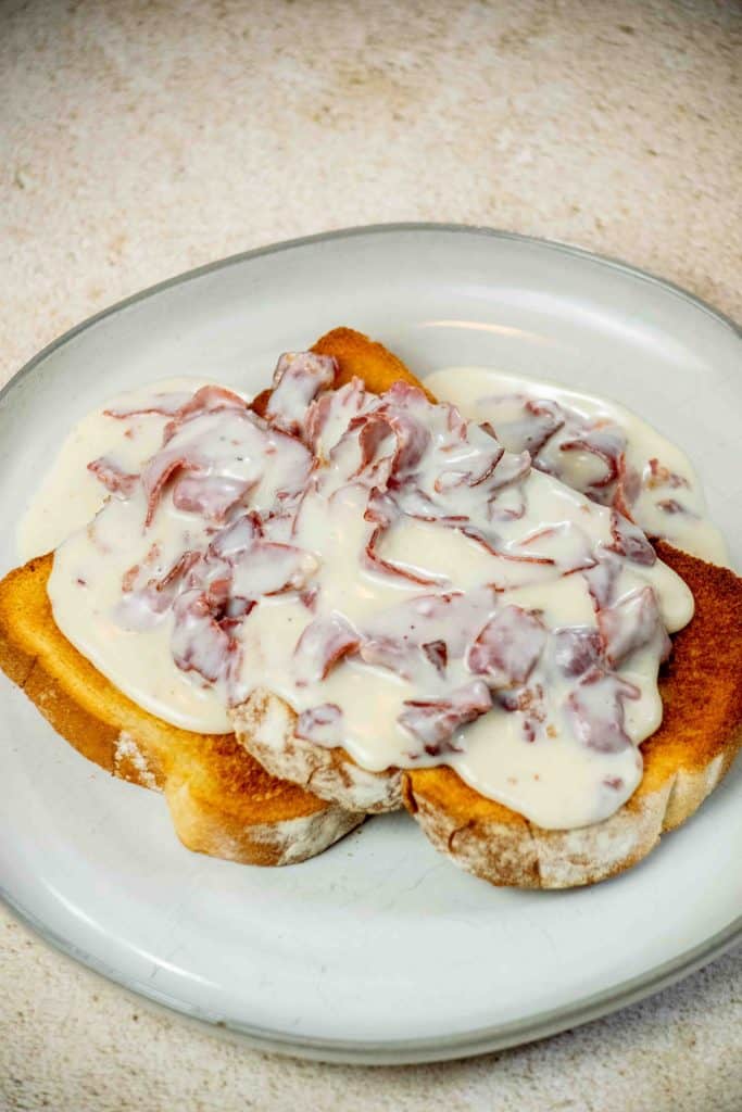 prepare toast, and spoon hot gravy over toast
