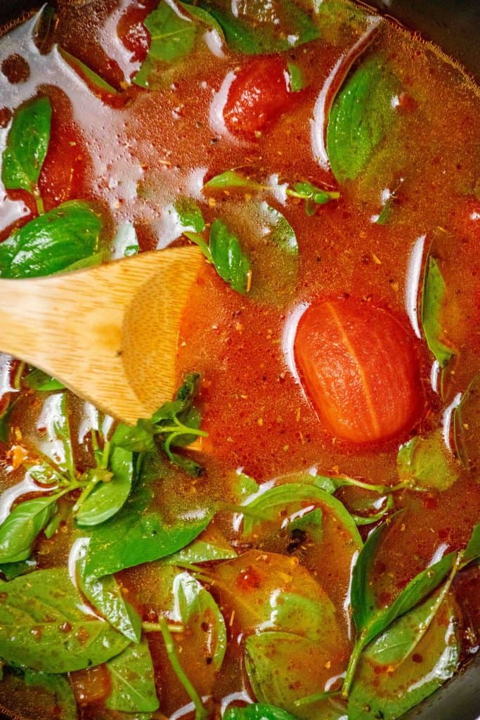 add the canned tomatoes, basil, oregano, sugar, balsamic and chicken stock to the pot