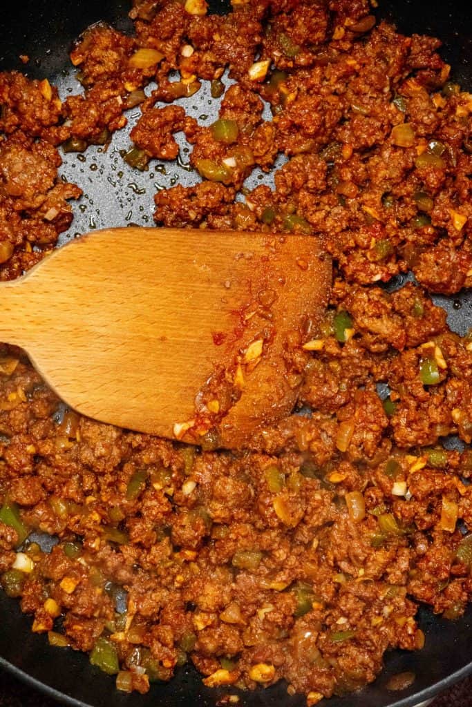 add garlic and tomato paste, and cook until deepened in color. 