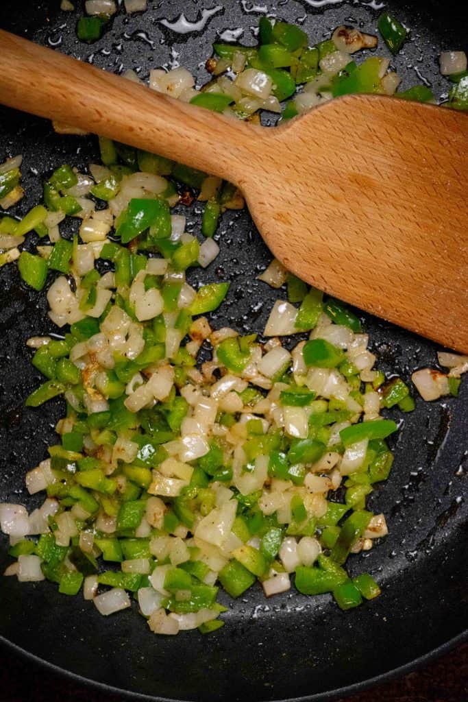 Cook the bell pepper and onions in butter until softened 