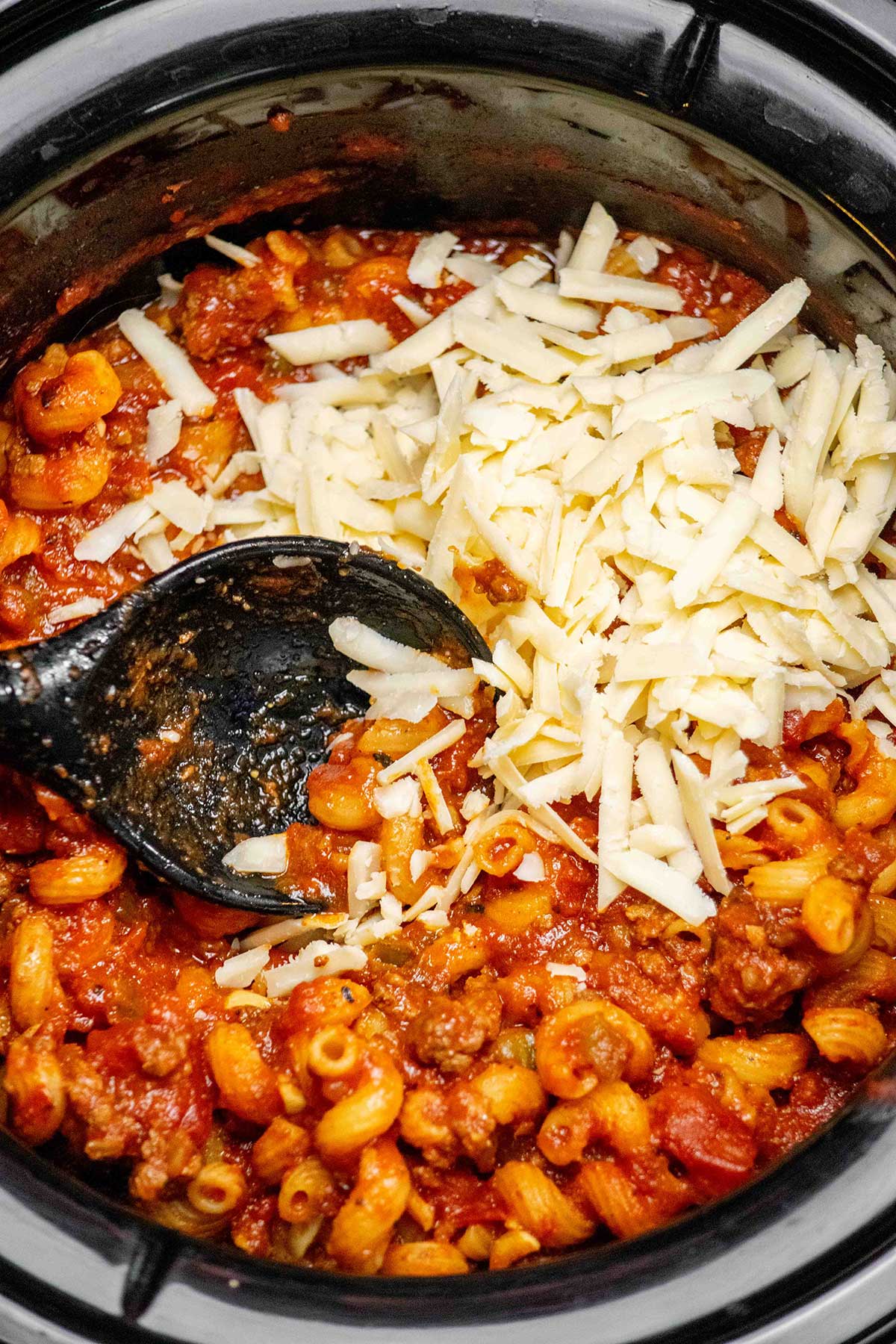 Add the cheese. If using, stir in the shredded cheddar until completely melted and incorporated.