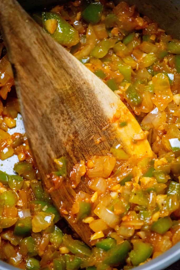 add the tomato paste and garlic, and cook until tomato paste takes on deep color, 2-3 minutes. 