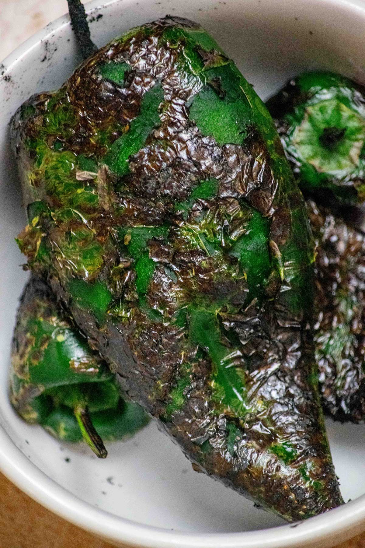Roast the poblanos. Char the peppers under the broiler, on a grill, or over a gas flame. Let them steam briefly, then peel, seed, and roughly chop.