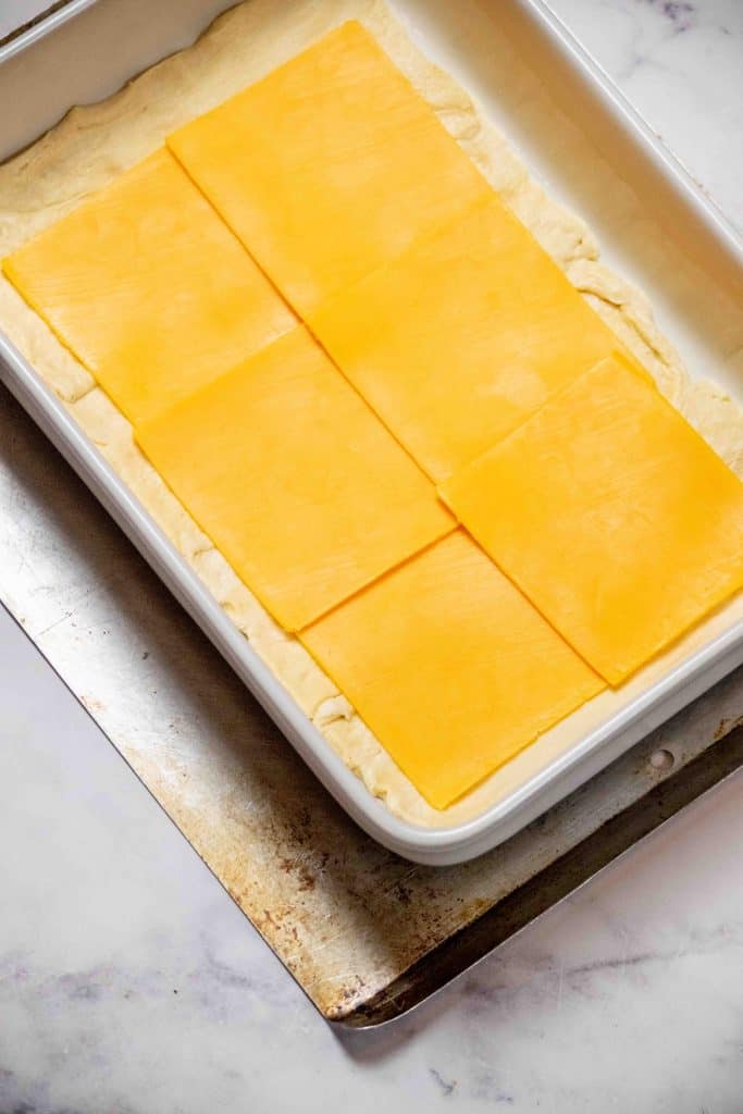 layer on sliced cheddar