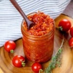 Tomato jam in a jar ready to spread.