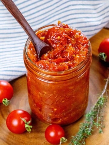 Tomato jam in a jar ready to spread.
