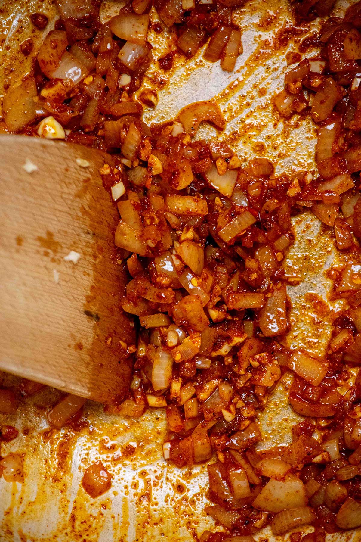 Once onions are softened, add the dry spices and garlic, and cook until just fragrant, about 30 seconds. 