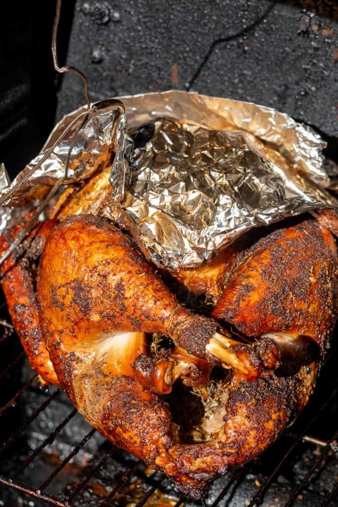 smoke the turkey with a digital probe thermometer inserted until breast temperature reaches 155 degrees f.