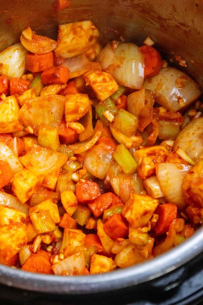 add tomato paste and cook until deepened in color, 2-3 minutes, then add garlic and cook for 30 seconds