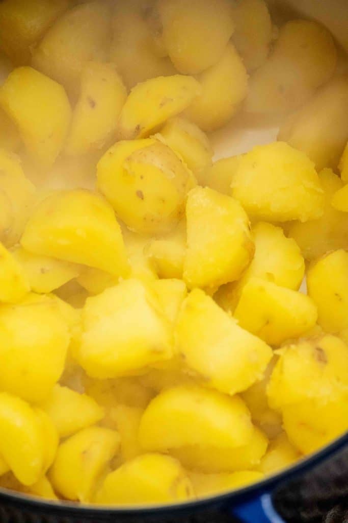 drain potatoes well, and return to pot to remove excess liquid