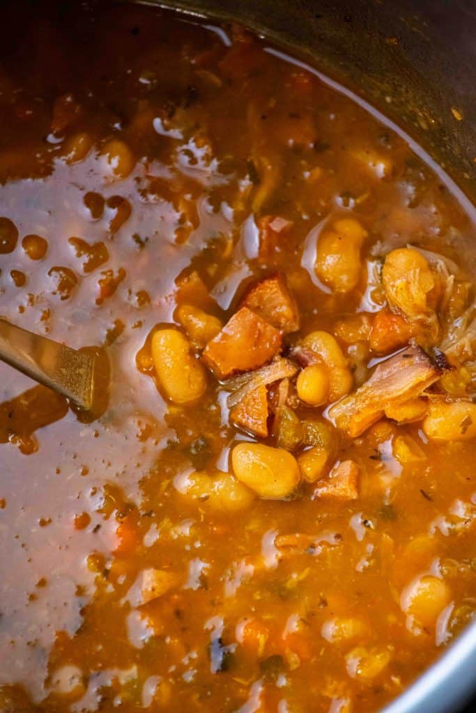 shred ham, removing any fat and bones, and return ham meat to soup