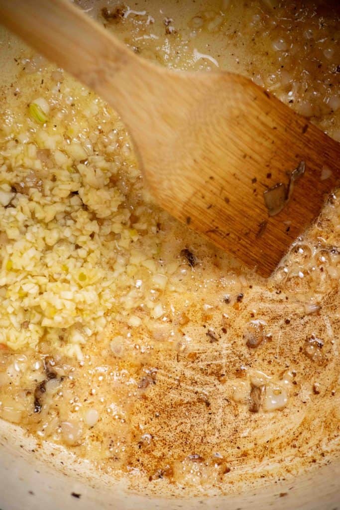 cook shallots in butter, then add garlic and cook 30 seconds. 