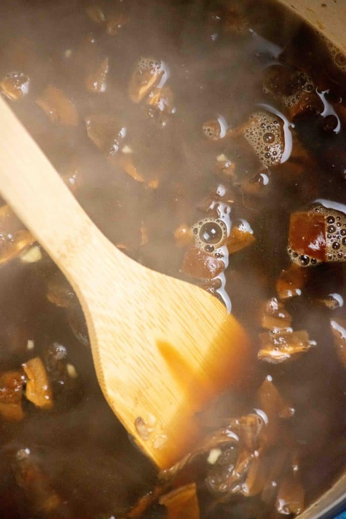 add 5 cups of broth, cover and cook 30 minutes. 