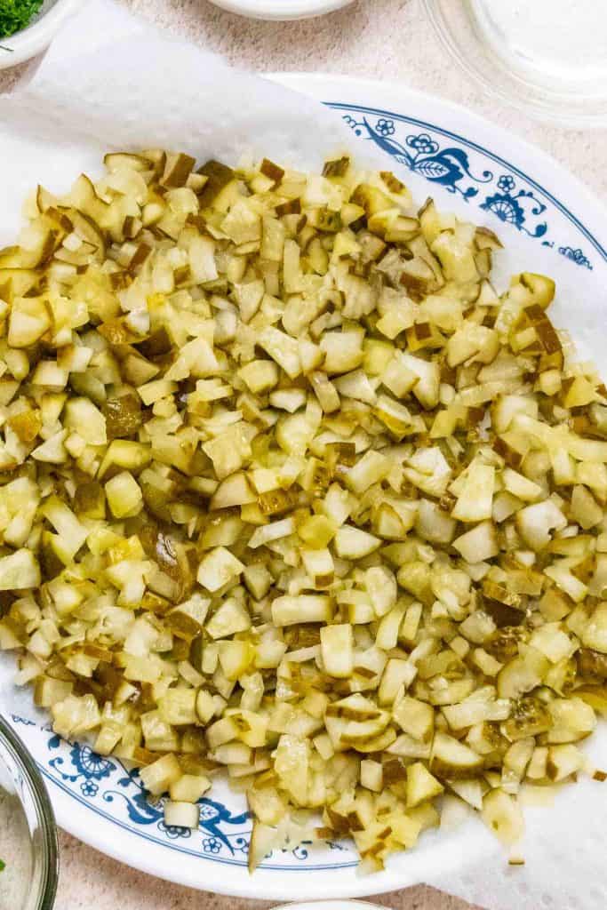 chop pickles and dry on paper towels