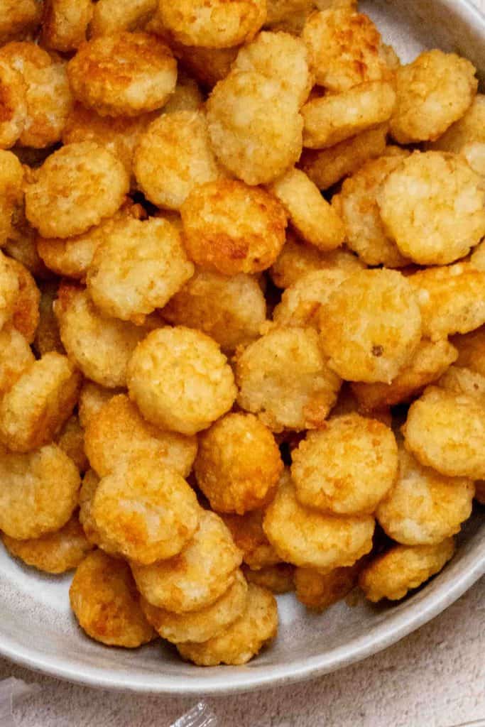 Prepare tater tots or crispy crowns according to package directions